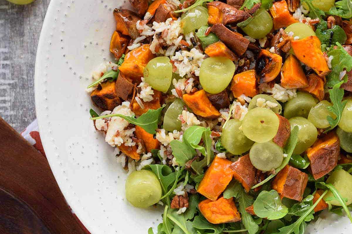         Vegan sweet potato and grape salad, perfect for Thanksgiving.
