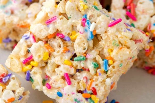 Rice krispie squares with sprinkles on top.