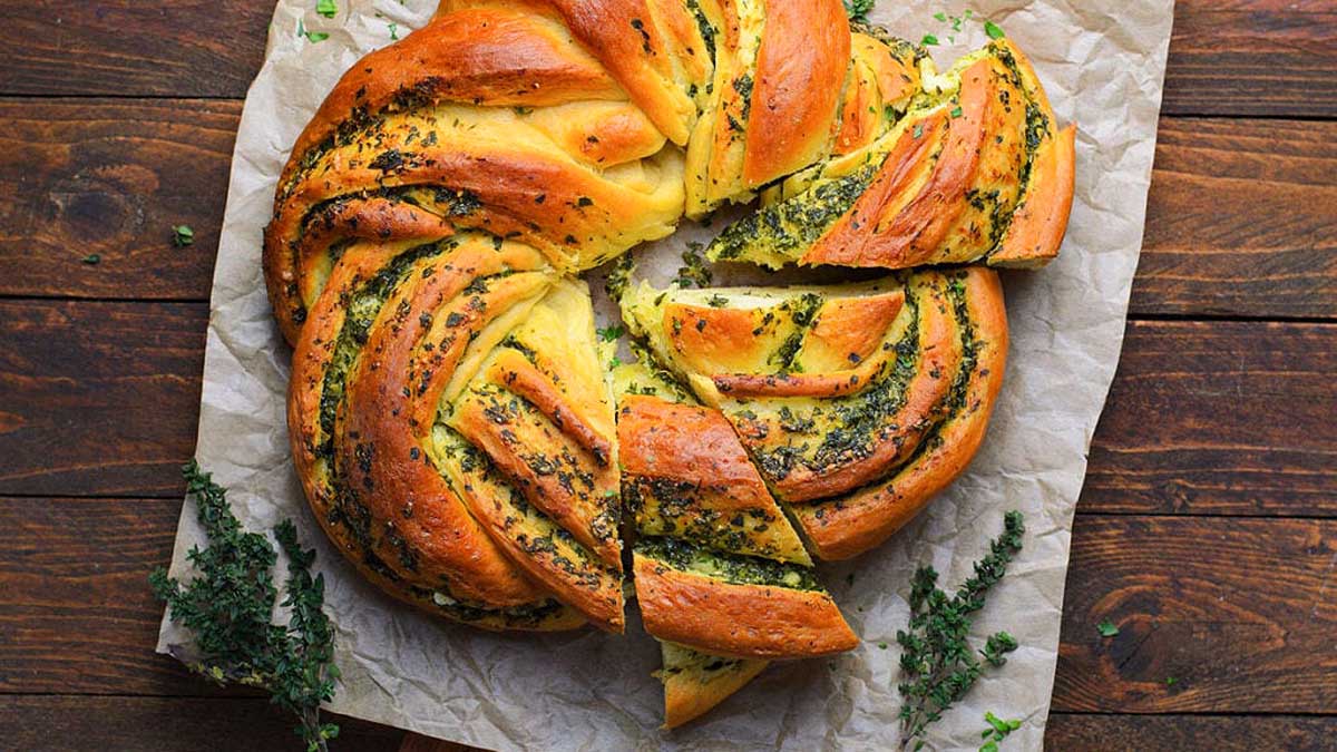 A braided bread with herbs, perfect for Christmas party appetizers.