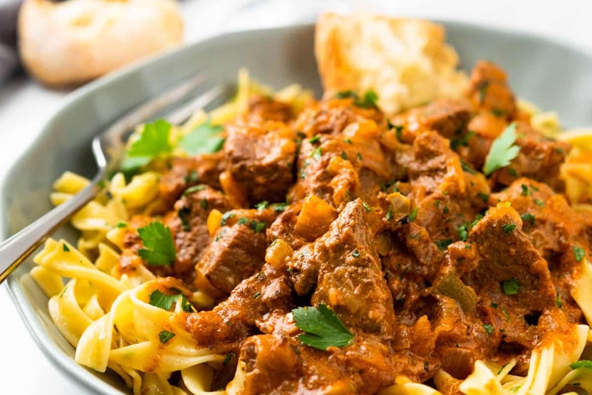 A German-inspired bowl of pasta with beef in a sauce.