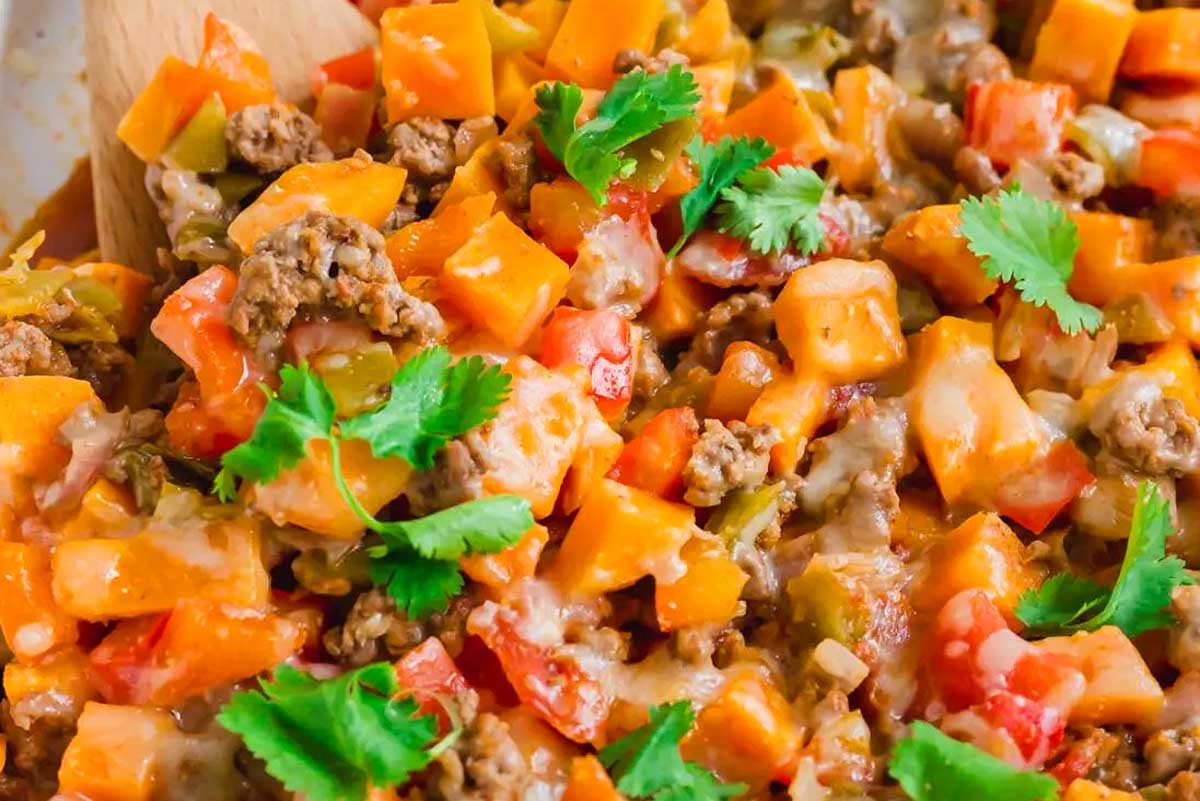 A bowl of meat and sweet potato casserole.