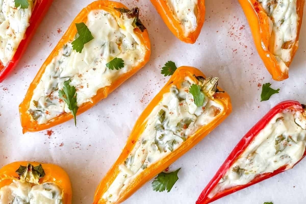 Appetizers for New Year's Eve: Stuffed peppers with cheese and cilantro.