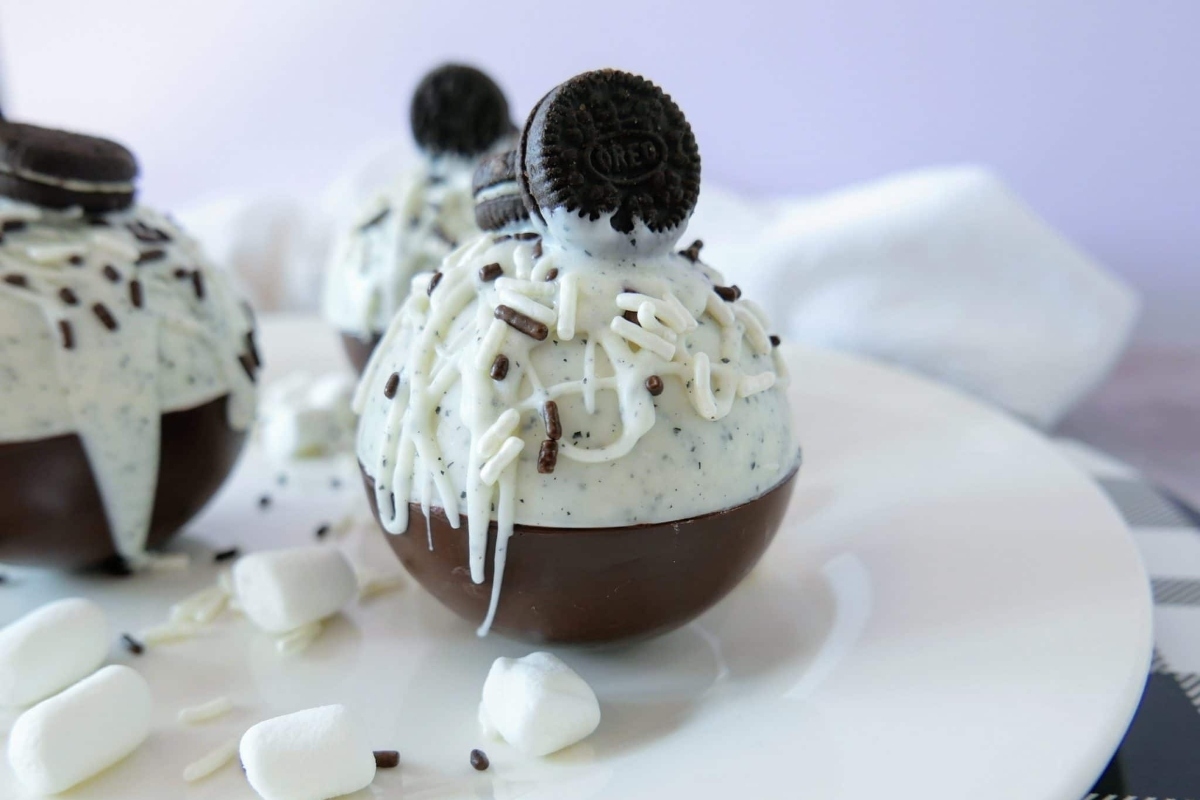 Oreo ice cream balls served on a festive Christmas plate.