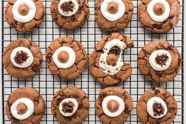 Hot cocoa cookies on a cooling rack.