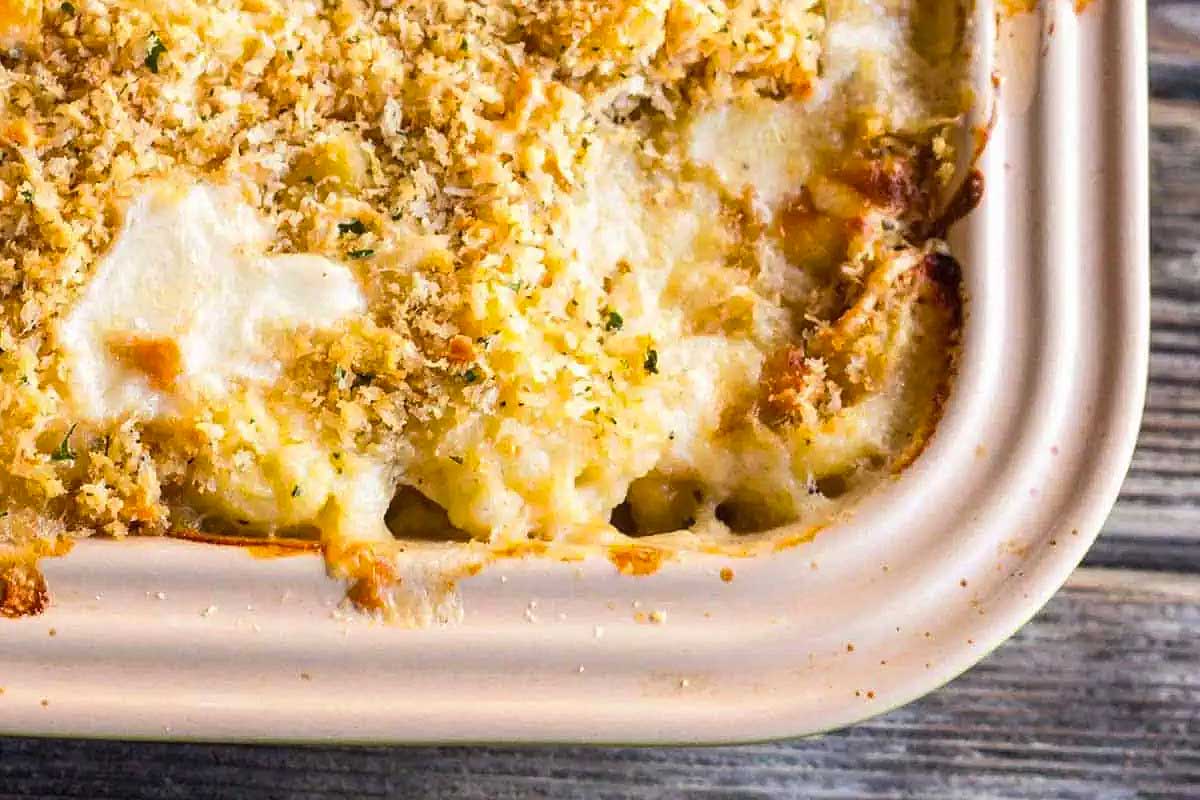 A friends giving casserole dish filled with cheesy macaroni and cheese.