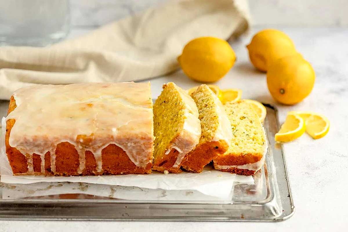 A loaf of zucchini bread with icing on top. This is one of the best zucchini recipes.