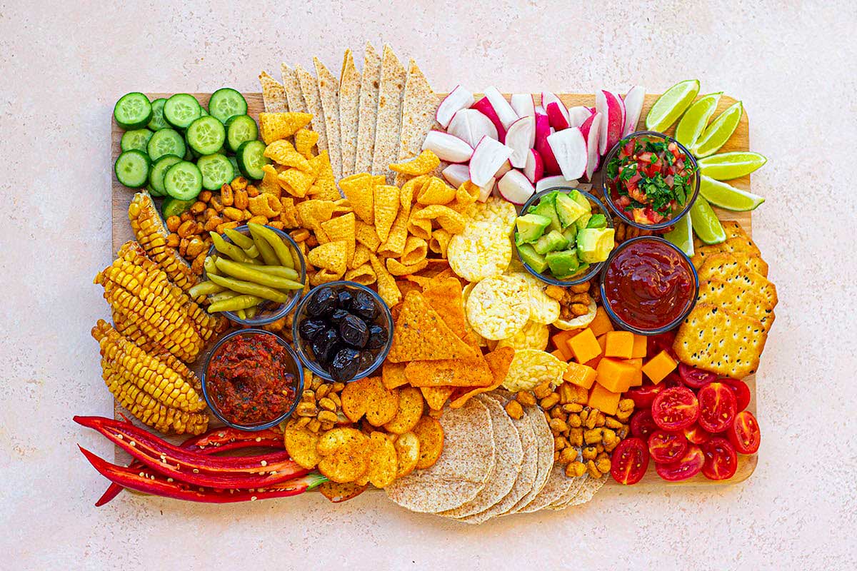 A platter of different kinds of snacks on a table.