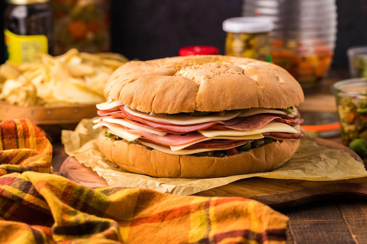 A ham and cheese sandwich served on a bun.