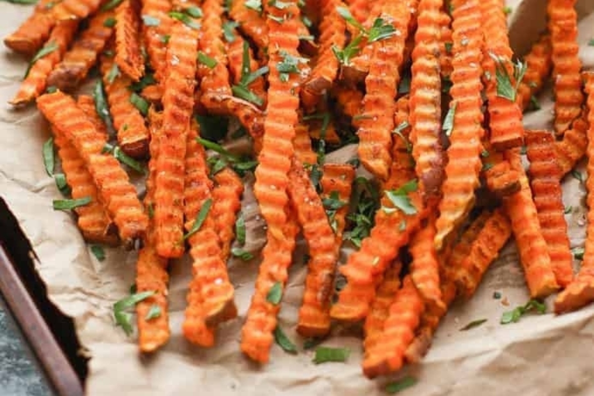 Sweet potato fries on a baking sheet.