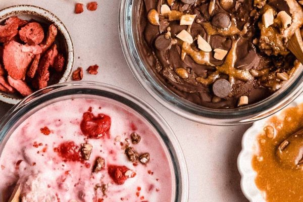 Three bowls of ice cream with different toppings, perfect for a sweet meal prep treat.