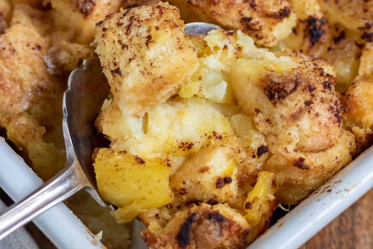 A mouthwatering bread pudding recipe, complete with a spoon in it.