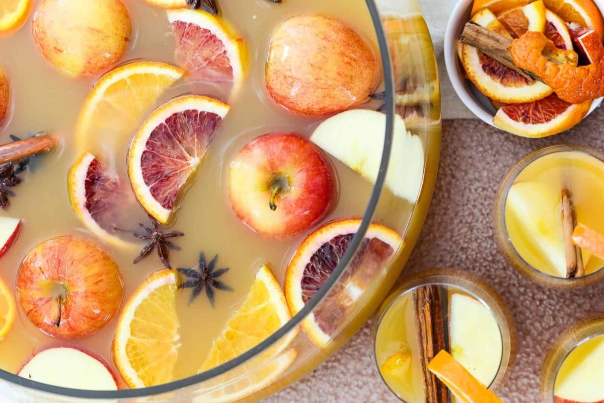 Large punch bowl with fireball punch and orange slices. 
