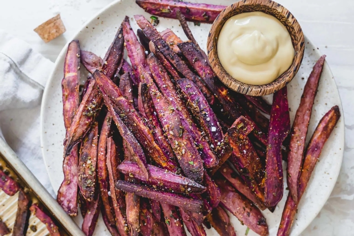 Sweet potato fries with a dip on a plate.