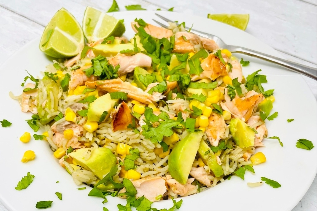 A plate with salmon and avocado on it.