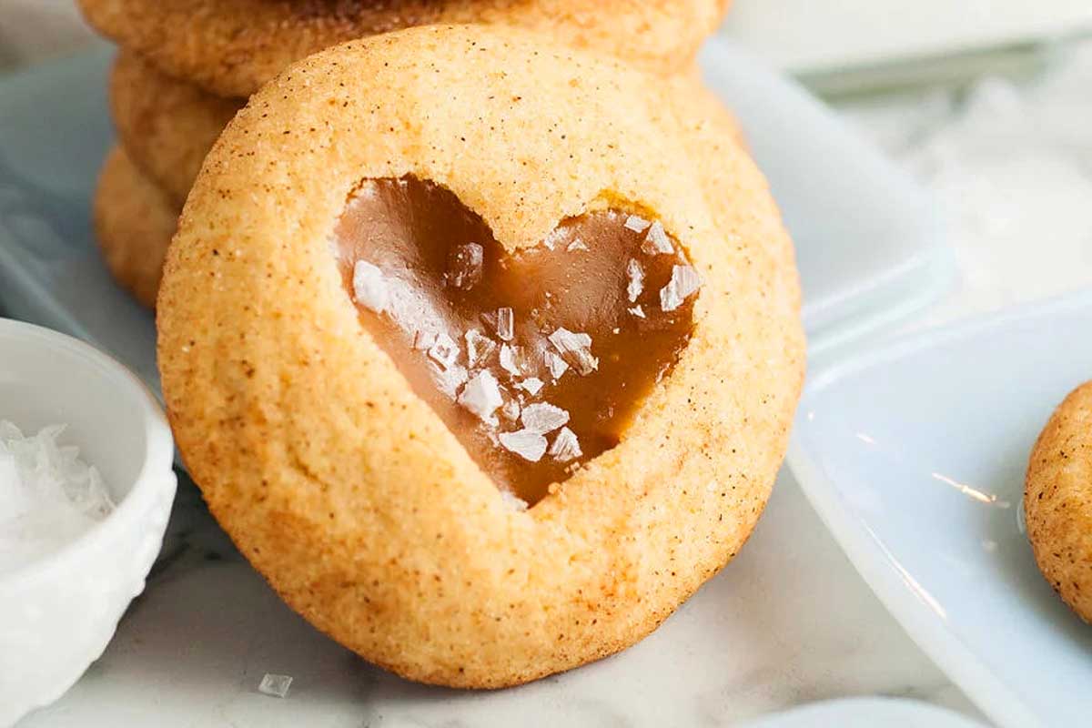 A plate of cookies with a heart in the middle.