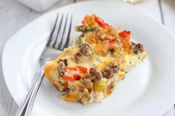 A slice of breakfast casserole on a plate.