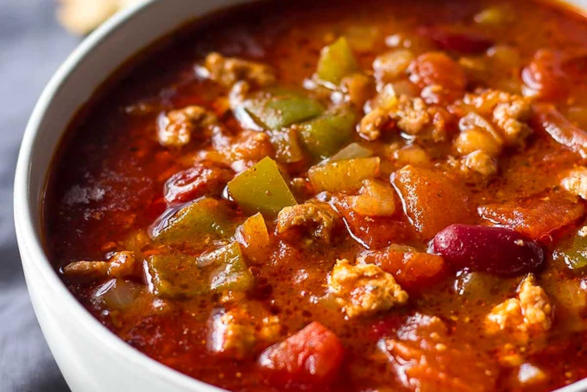 A slow cooker soup with meat and vegetables.