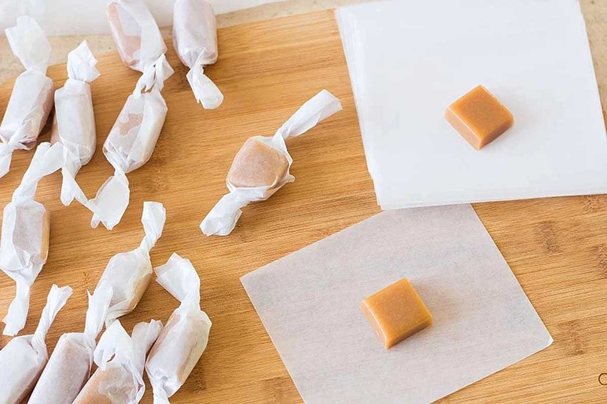 Caramel taffy on a cutting board.