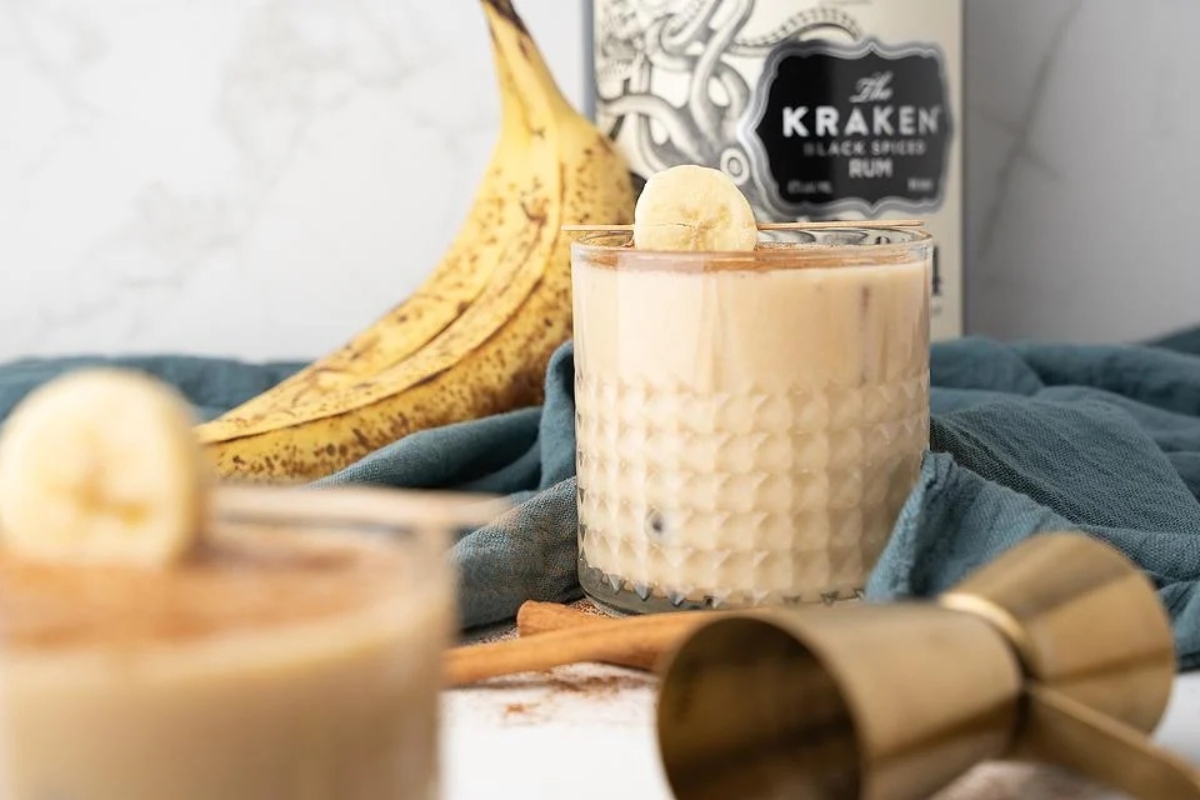 Bananas foster eggnog with a banana and a bottle of kahlua.