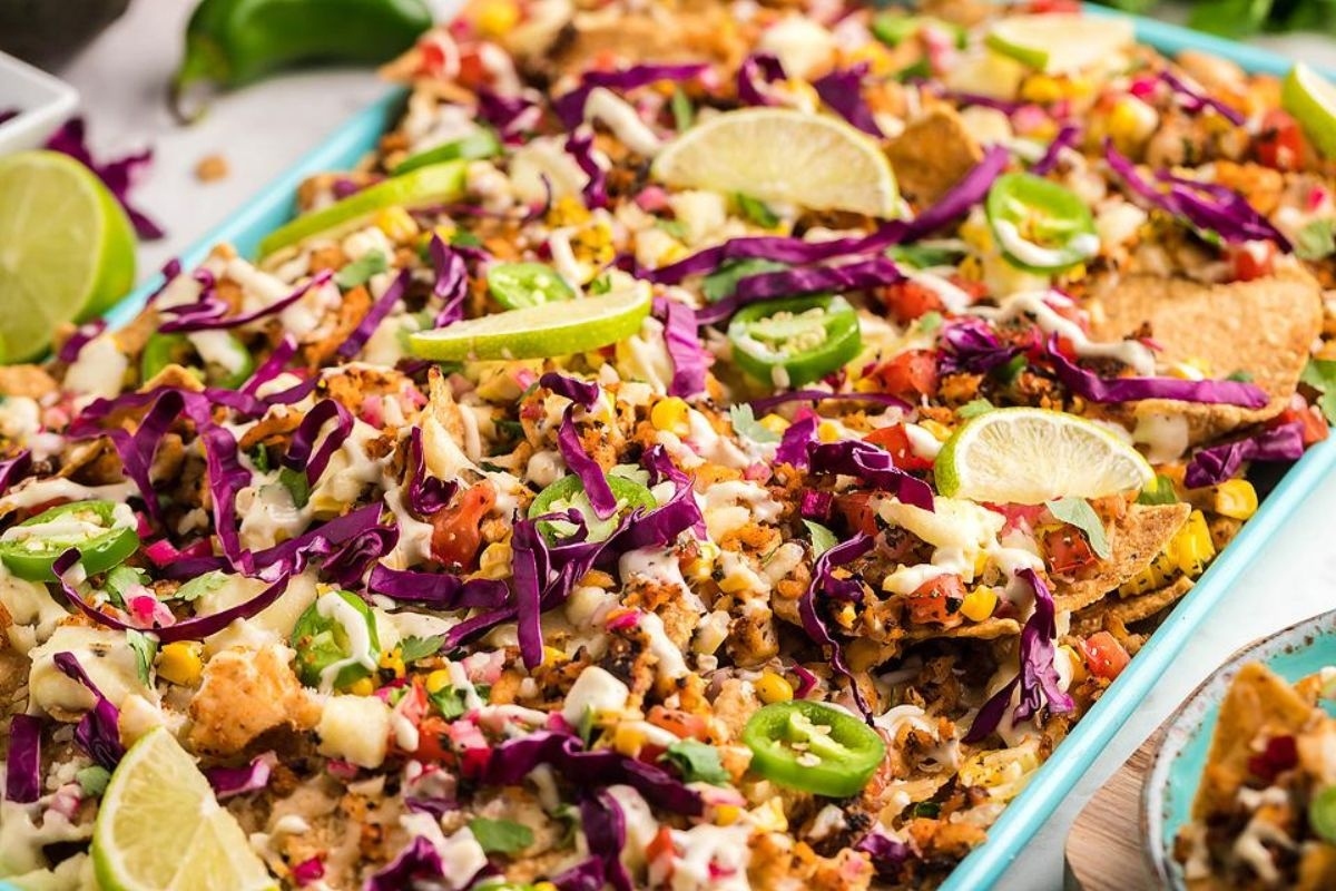 Mexican nachos in a blue baking dish.