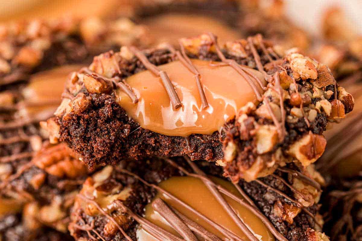 Turtle Thumbprint Cookies with a bite taken.