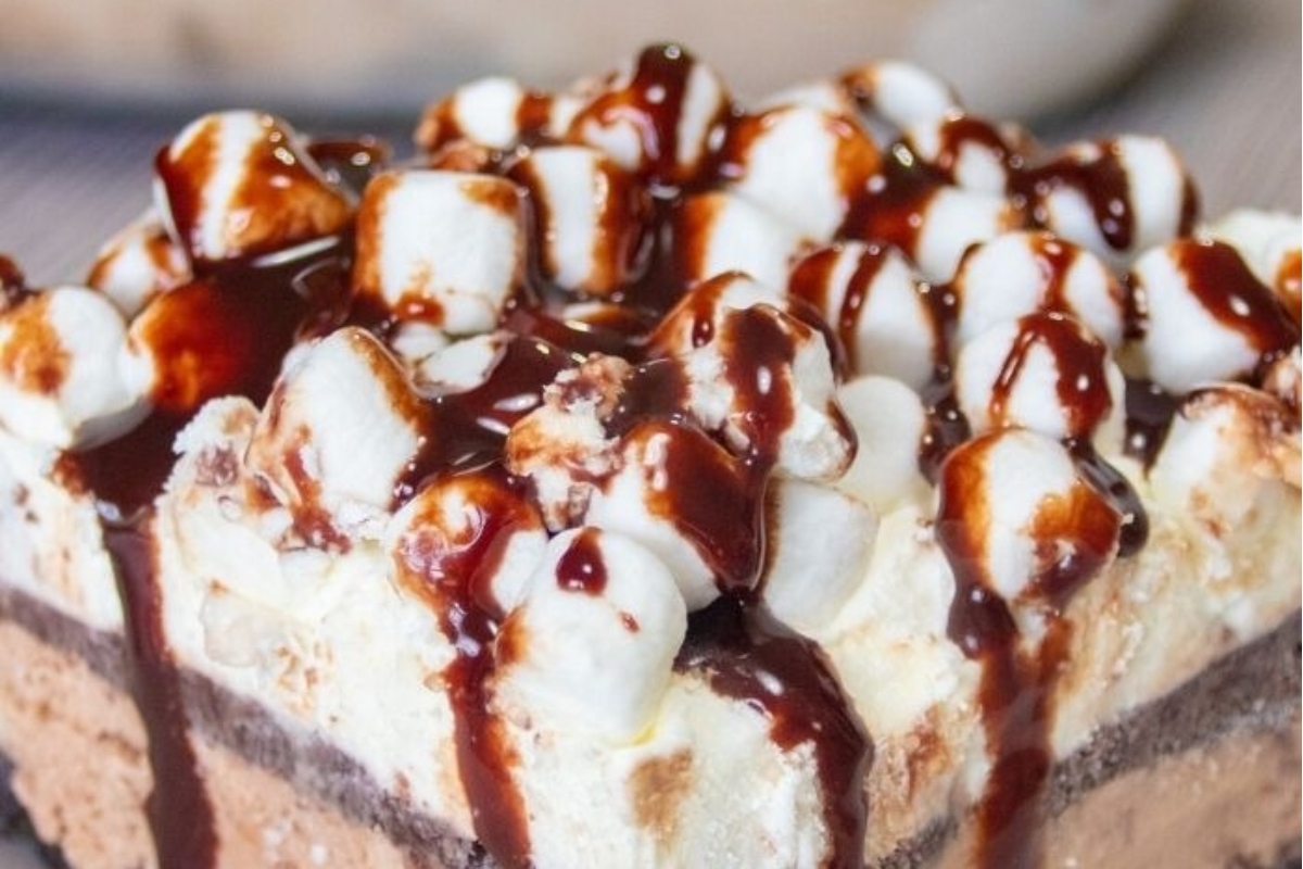 A delicious dessert recipe featuring a piece of chocolate cake with marshmallows on top.