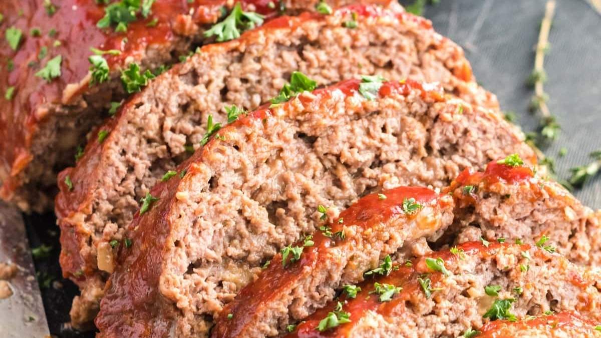A comforting slice of meatloaf shared on a plate.