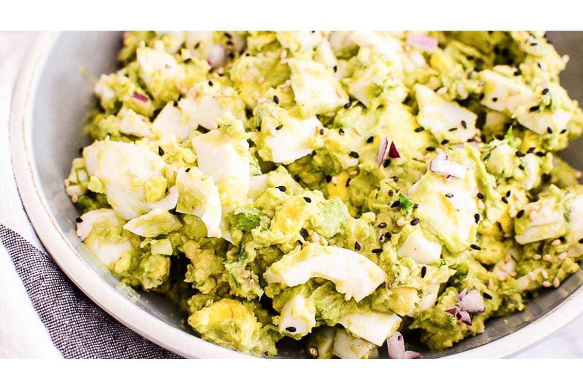 A high-protein bowl of guacamole in a white bowl.