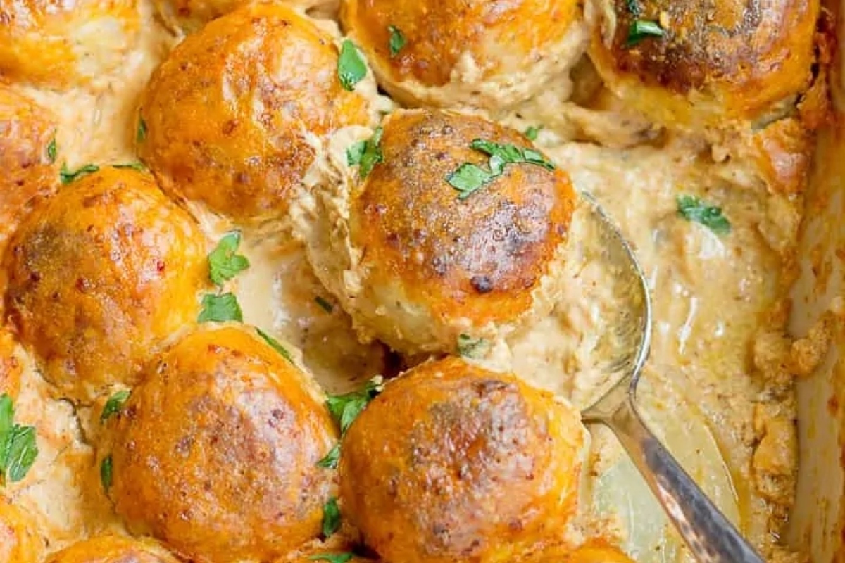 A winter dinner dish filled with meatballs and parsley.