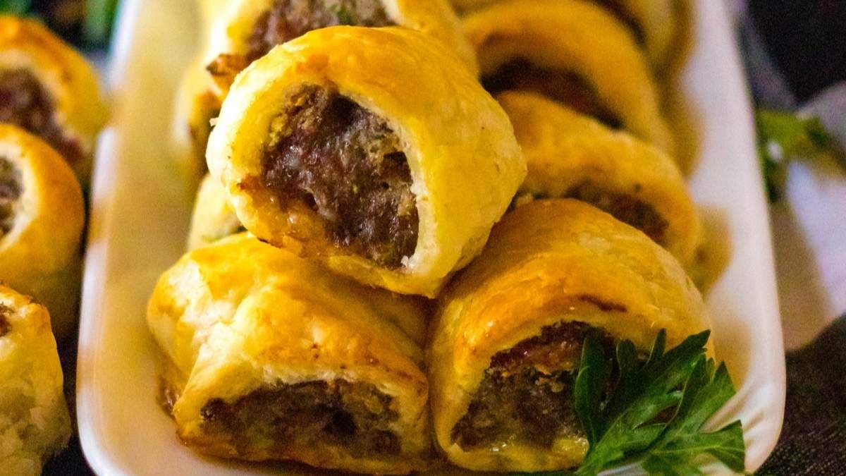 A shared plate of meat and cheese pastries, perfect for a comfort food round up.