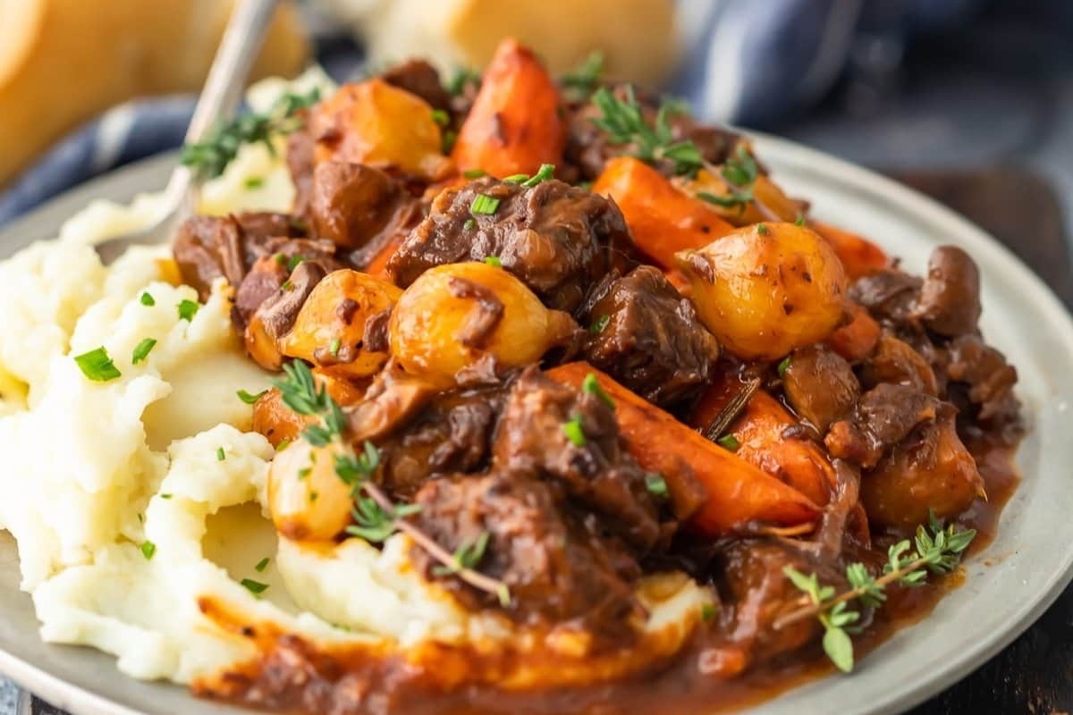 Beef stew with potatoes and carrots on a plate.