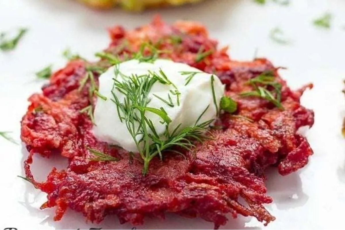 Beetroot pancakes with sour cream and dill are a delicious and colorful twist on traditional pancakes. These fluffy pancakes incorporate the earthy flavor of beets, complemented by the creamy tang of sour