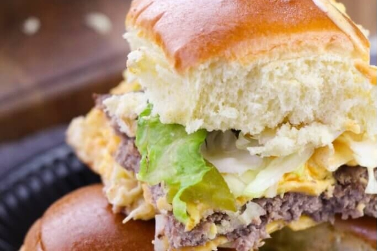 The easiest recipe for game day burger sliders served on a black plate.