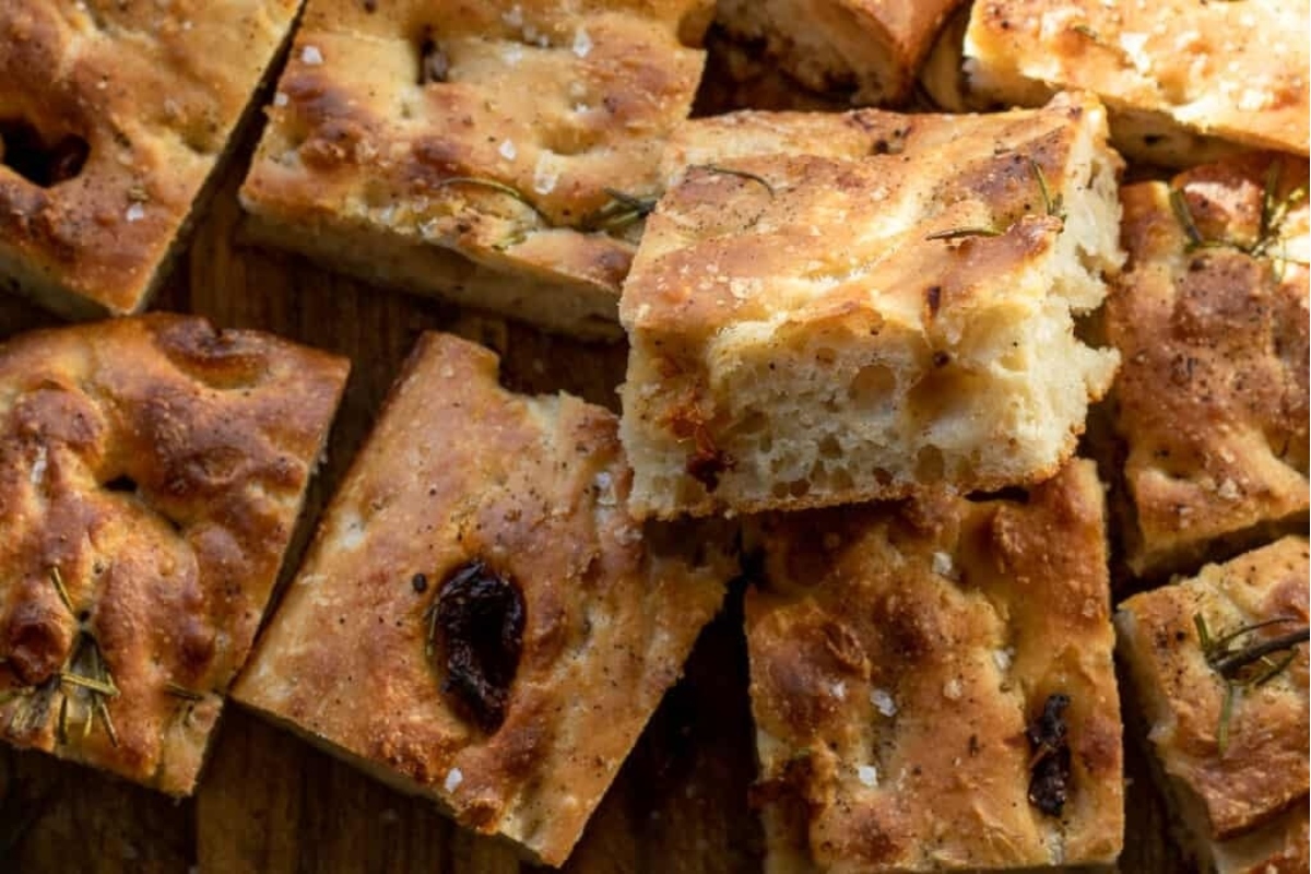 Some slices of Focaccia bread on a cutting board.