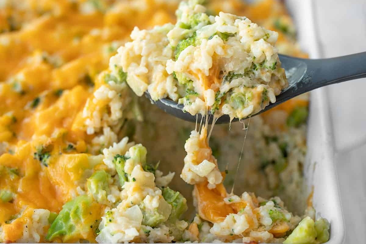 A Christmas-themed side dish of broccoli rice casserole in a festive casserole dish.