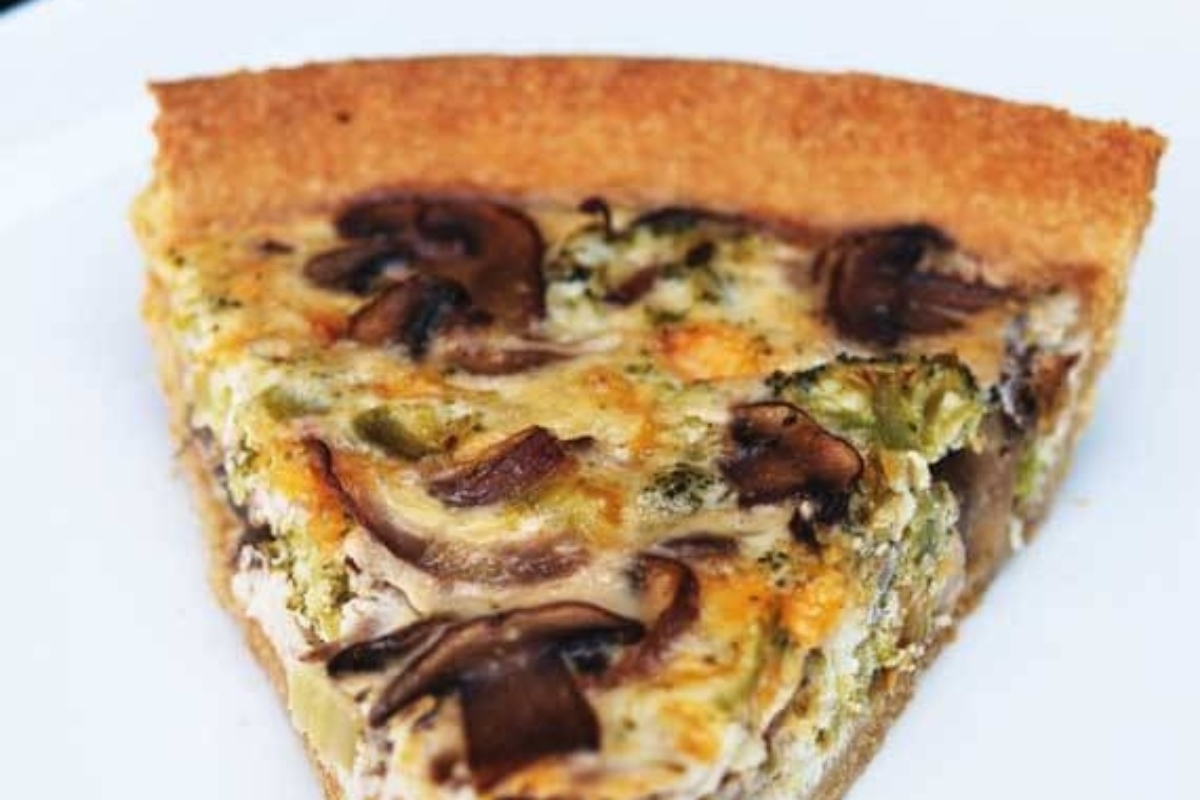 A delectable broccoli quiche on a white plate, perfect for your recipe collection.