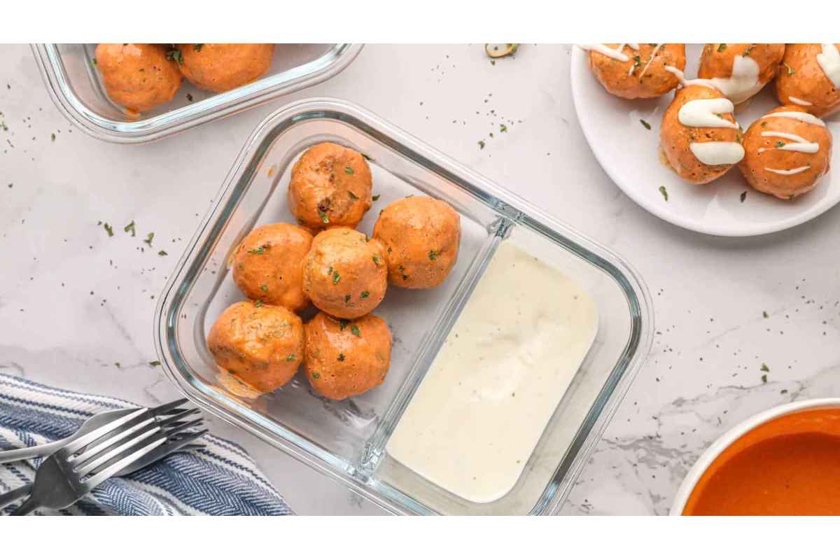 A plate with a bowl of healthy food and a bowl of dipping sauce.