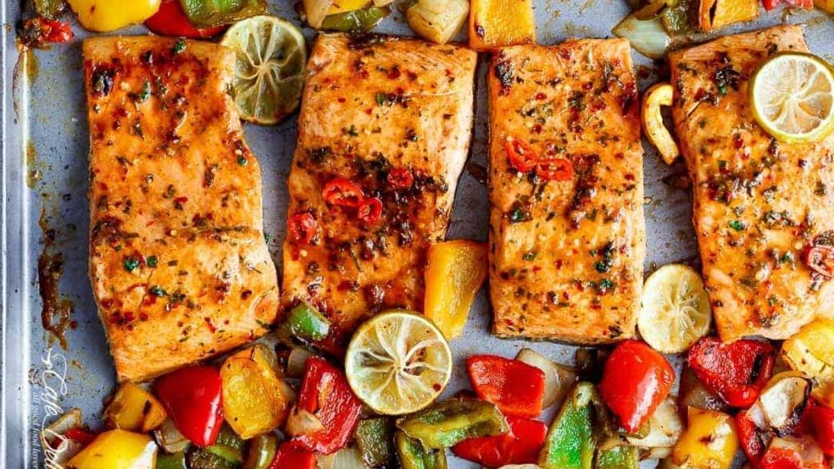 Shared recipes for comfort food like grilled salmon and vegetables on a baking sheet.