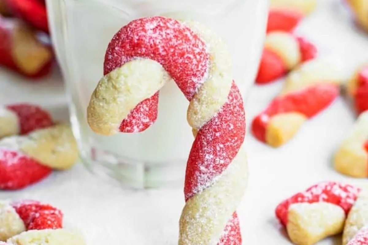 Delicious candy cane cookies alongside a refreshing glass of milk.