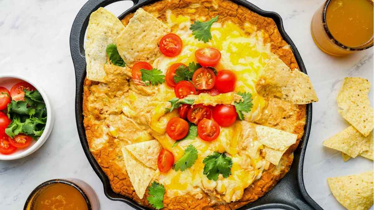 Cheesy dip with cherry tomatoes.