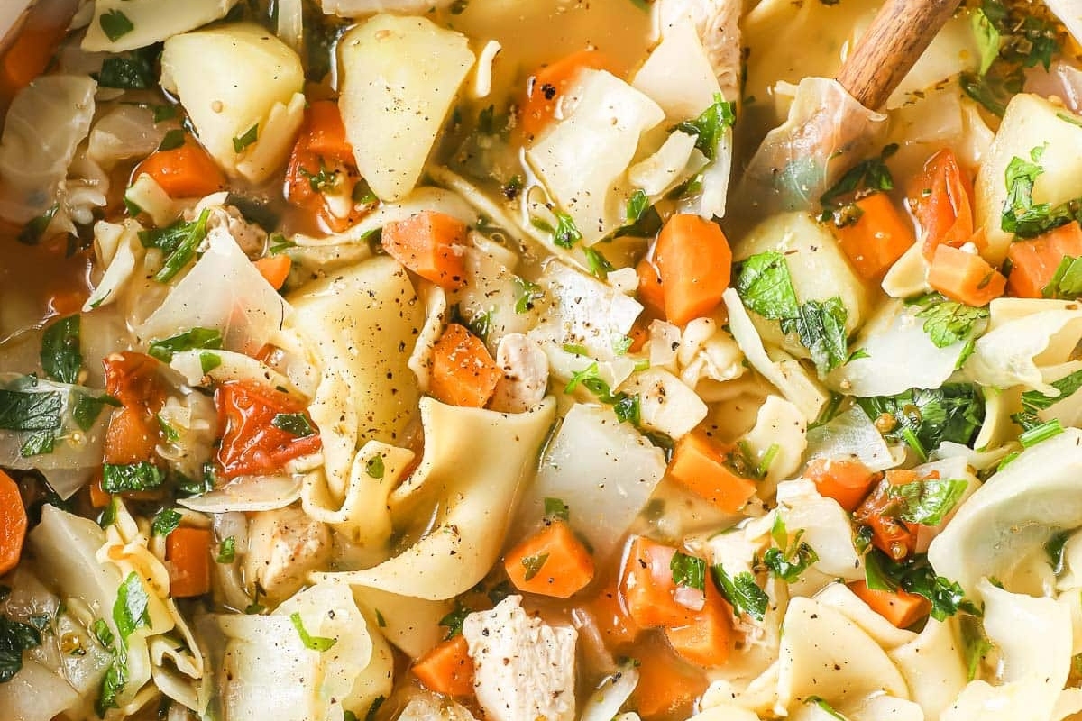 Vegetable soup with chicken and noodles.