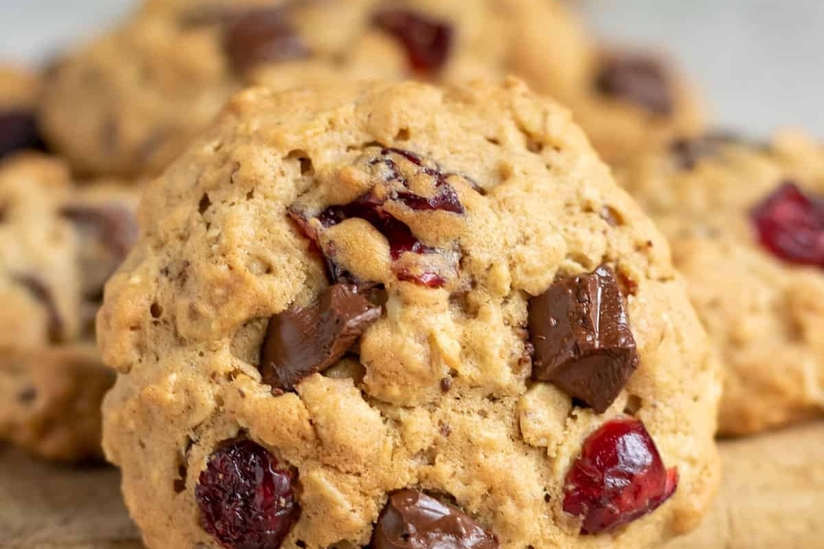 Cranberry chocolate chip cookies on a cutting board, perfect for a quick snack or dessert.