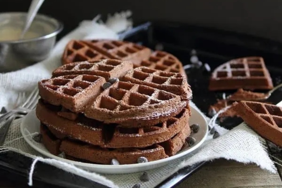 Indulge in these decadent chocolate waffles topped with luscious chocolate chips.