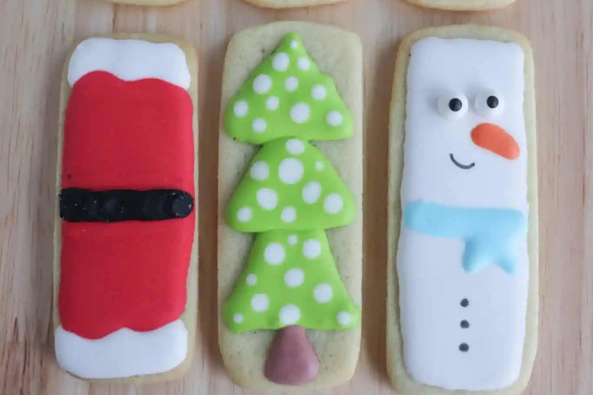 Christmas Cut Out Cookies decorated with santa claus, snowman and reindeer.