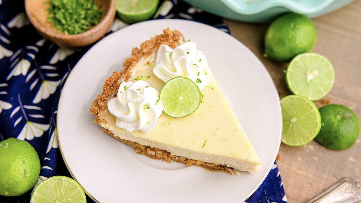 A slice of key lime pie on a plate.