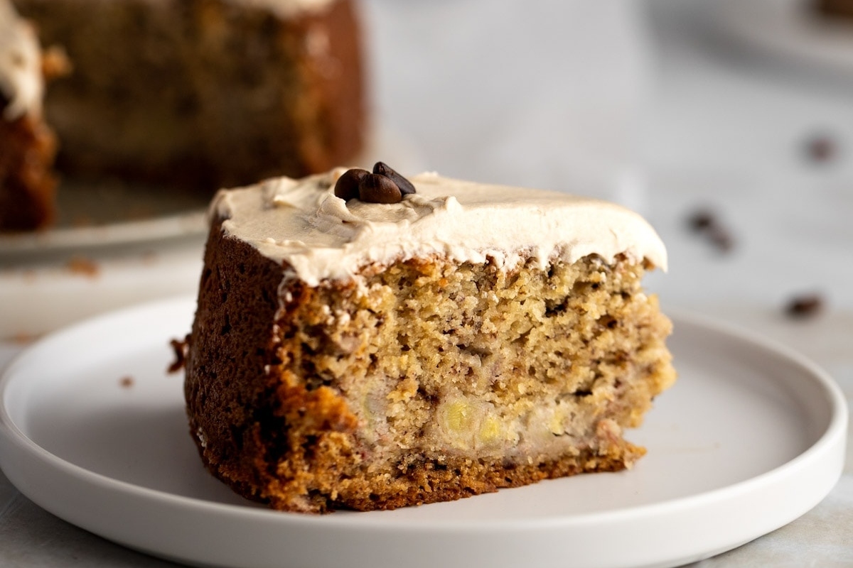 A slice of banana cake on a plate, perfect for breakfast or holiday bakes.
