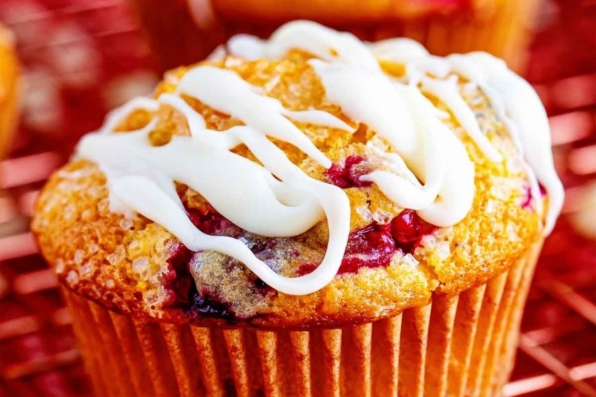 Cranberry muffins with white icing, a perfect snack for cranberry lovers.