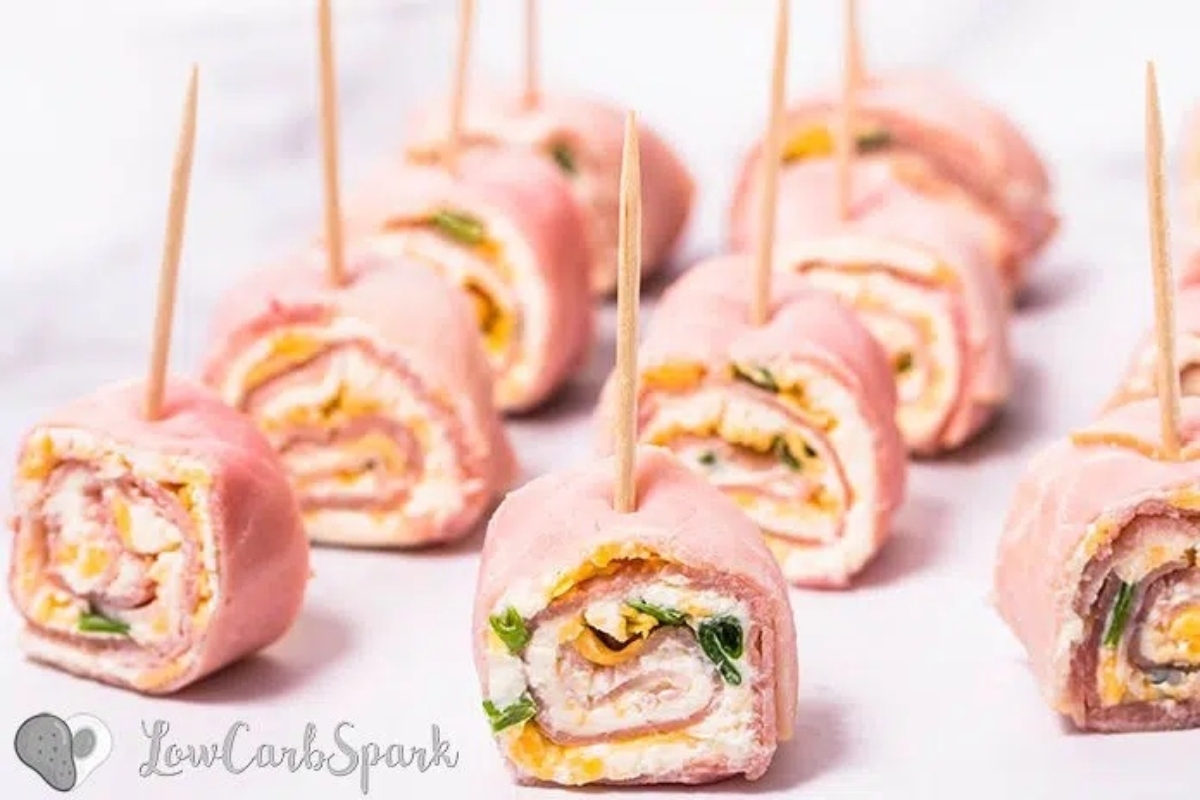 Cheesy Christmas appetizers: Ham and cheese roll ups on toothpicks.