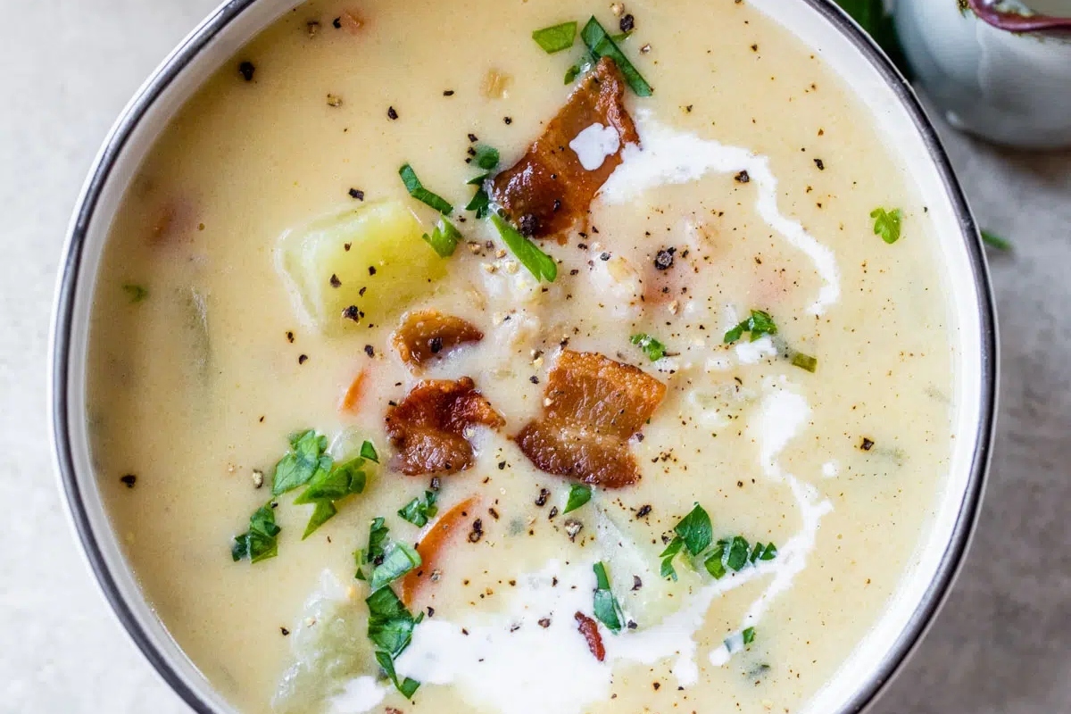 A hearty bowl of potato soup with savory bacon and a creamy touch of sour cream.