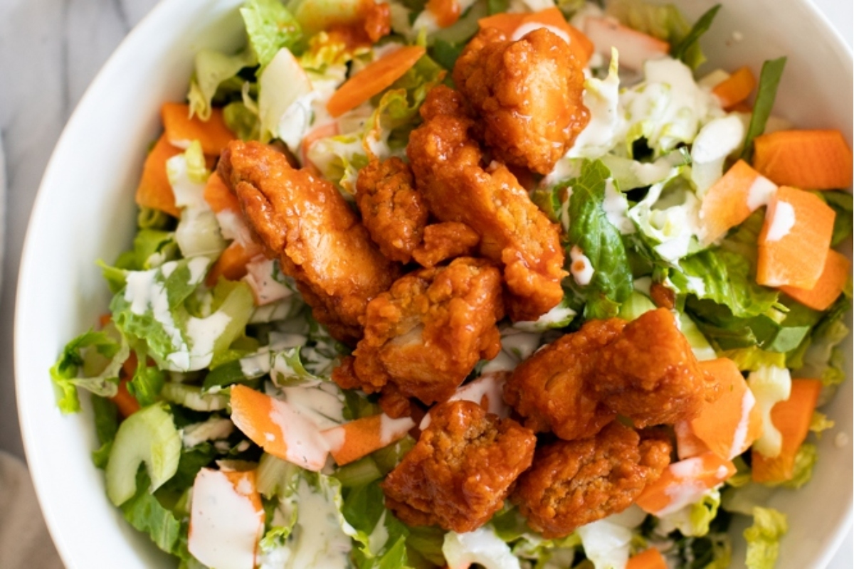 Main Dish Salads: Fried chicken salad served in a white bowl, creating a hearty and satisfying meal.